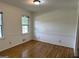 Bright dining room features hardwood floors, neutral walls with white trim, and two windows at 370 Rosetta Nw Ln, Conyers, GA 30012
