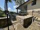 Inviting outdoor area with stone patio, bench seating, and charming covered porch perfect for entertaining at 370 Rosetta Nw Ln, Conyers, GA 30012