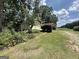Exterior of a two car garage, surrounded by greenery, on a sunny day at 370 Rosetta Nw Ln, Conyers, GA 30012
