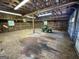 View of garage interior with John Deere lawn mower at 370 Rosetta Nw Ln, Conyers, GA 30012