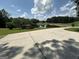 Scenic view of a tranquil pond surrounded by lush greenery and a sprawling lawn at 370 Rosetta Nw Ln, Conyers, GA 30012