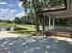 Peaceful scene featuring a pond view from the covered porch, with a glimpse of the home's exterior at 370 Rosetta Nw Ln, Conyers, GA 30012
