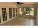 Bright sunroom featuring tiled floors and french doors leading to outdoor area at 370 Rosetta Nw Ln, Conyers, GA 30012