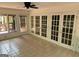 Bright sunroom featuring tiled floors and french doors leading to outdoor area at 370 Rosetta Nw Ln, Conyers, GA 30012