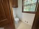 Toilet room featuring a classic toilet and a small window for natural light at 370 Rosetta Nw Ln, Conyers, GA 30012