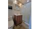 Bathroom featuring a toilet, vanity, shower and lighting fixture at 4157 Cedar Valley Ln, Conley, GA 30288