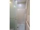 Tiled shower with glass door and mosaic tile floor in renovated bathroom at 4157 Cedar Valley Ln, Conley, GA 30288