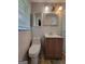 Bathroom featuring a toilet, vanity, shower and window with blinds at 4157 Cedar Valley Ln, Conley, GA 30288