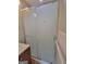 Bathroom featuring glass shower doors, tile and updated fixtures at 4157 Cedar Valley Ln, Conley, GA 30288