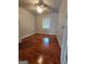 A bedroom featuring hardwood floors, a ceiling fan, and natural light through the window at 4157 Cedar Valley Ln, Conley, GA 30288