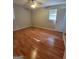 Neutral bedroom featuring wood-look floors, ceiling fan and a window with blinds at 4157 Cedar Valley Ln, Conley, GA 30288