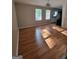 Bright dining room with abundant natural light from large windows at 4157 Cedar Valley Ln, Conley, GA 30288