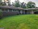 Lovely brick ranch with a covered carport and a solar panel system at 4157 Cedar Valley Ln, Conley, GA 30288