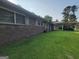 Cozy brick ranch home featuring an attached carport and well-maintained lawn at 4157 Cedar Valley Ln, Conley, GA 30288