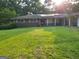 Inviting one-story brick home with solar panels and a well-kept front lawn at 4157 Cedar Valley Ln, Conley, GA 30288