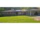 Beautiful brick home with solar panels on the roof and attached carport at 4157 Cedar Valley Ln, Conley, GA 30288