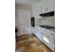 Traditional kitchen with white cabinets and stove top at 4157 Cedar Valley Ln, Conley, GA 30288