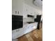 A kitchen featuring painted cabinets, tiled floors and stainless steel refrigerator at 4157 Cedar Valley Ln, Conley, GA 30288