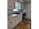 Traditional kitchen featuring white cabinets and tile floor at 4157 Cedar Valley Ln, Conley, GA 30288