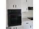 Traditional kitchen with updated, built-in oven and white cabinets at 4157 Cedar Valley Ln, Conley, GA 30288