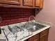 Bright kitchen sink with modern faucet and countertops at 4157 Cedar Valley Ln, Conley, GA 30288