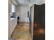 Traditional kitchen with stainless steel refrigerator and white cabinets at 4157 Cedar Valley Ln, Conley, GA 30288