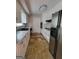 Kitchen with white cabinets, stainless steel refrigerator and tiled flooring throughout at 4157 Cedar Valley Ln, Conley, GA 30288