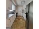 Kitchen with white cabinets, stainless steel refrigerator and tiled flooring throughout at 4157 Cedar Valley Ln, Conley, GA 30288