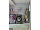 Functional laundry room with washer, dryer, utility shelving and water heater at 4157 Cedar Valley Ln, Conley, GA 30288