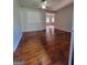 Bright living room featuring hardwood floors and a ceiling fan at 4157 Cedar Valley Ln, Conley, GA 30288
