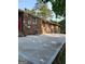 Spacious concrete patio area next to brick house at 4157 Cedar Valley Ln, Conley, GA 30288