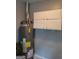 Efficient water heater in laundry room with storage above at 4157 Cedar Valley Ln, Conley, GA 30288