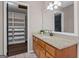Bathroom featuring a granite countertop, tile floor, wood cabinets, and neutral walls at 3222 Bay View Dr, Jonesboro, GA 30236