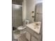 Bathroom featuring glass enclosed shower, vanity, tile floor, and toilet at 1308 Camelot Dr, South Fulton, GA 30349