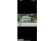 Sign for Camelot Club Condominiums amidst lush landscaping and trees at 1308 Camelot Dr, South Fulton, GA 30349