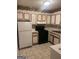 Kitchen featuring a full suite of appliances, cabinetry, and neutral color scheme at 1308 Camelot Dr, South Fulton, GA 30349