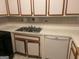 Kitchen with a stainless steel sink, white cabinetry, and a dishwasher at 1308 Camelot Dr, South Fulton, GA 30349