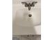 Bathroom sink with a stainless steel faucet and white countertop at 225 Bell St, Covington, GA 30016