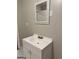Bathroom featuring a white vanity with a mirror and modern faucet fixture at 225 Bell St, Covington, GA 30016