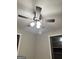 A modern ceiling fan with lighting fixture is centered in this bedroom at 225 Bell St, Covington, GA 30016