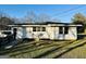 Side view of a home featuring a wheelchair ramp and satellite dish at 225 Bell St, Covington, GA 30016