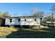 Side view of home with a visible painted concrete foundation at 225 Bell St, Covington, GA 30016