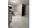 A newly renovated kitchen with tile flooring, modern cabinets, and appliances at 225 Bell St, Covington, GA 30016