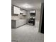 Spacious kitchen with ample counter space, stainless steel appliances and sleek design at 225 Bell St, Covington, GA 30016