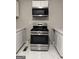 Close up of the kitchen featuring stainless steel gas range and oven at 225 Bell St, Covington, GA 30016