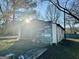 Exterior of a shed with damaged wood and concrete blocks at 225 Bell St, Covington, GA 30016