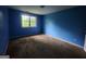 A bright bedroom with carpet floors and a large window at 6679 Cameron Rd, Morrow, GA 30260