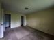 Bedroom with neutral walls, closet doors, and carpet flooring at 6679 Cameron Rd, Morrow, GA 30260