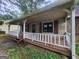 Covered front porch with stone accents on the exterior at 6679 Cameron Rd, Morrow, GA 30260