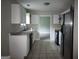 Kitchen featuring white cabinets, modern appliances, and tile floors at 6679 Cameron Rd, Morrow, GA 30260
